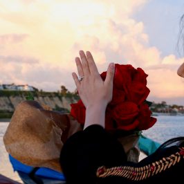 a group of people sitting at a beach