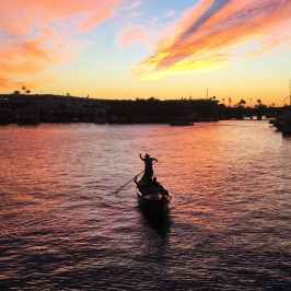 silhouette of gondolier in sunset