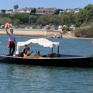 a group of people in a boat on a body of water