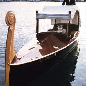 a boat is docked next to a body of water