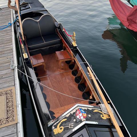 a boat is docked next to a body of water