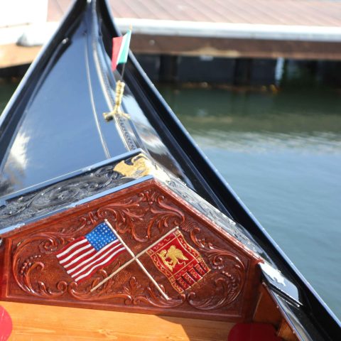 a boat sitting on top of a car