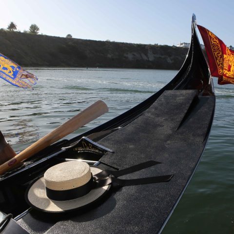 a close up of a boat next to a body of water