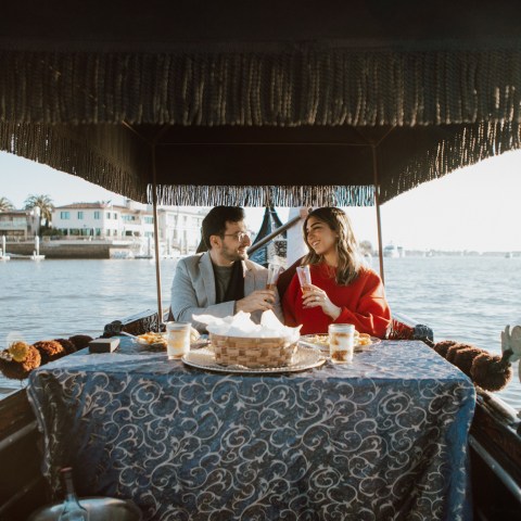 a group of people in a boat on a body of water