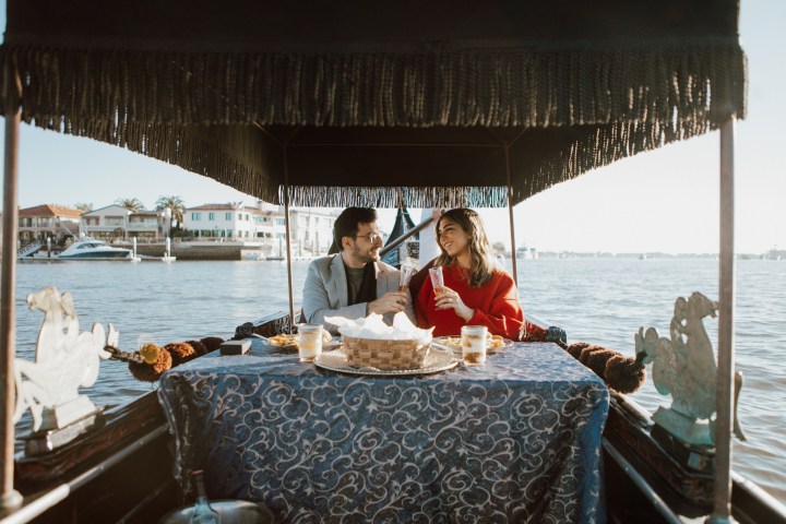 a group of people in a boat on a body of water